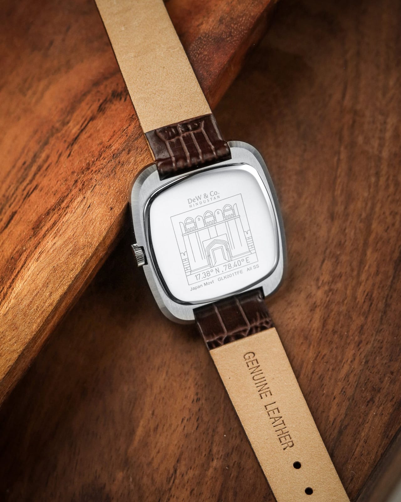Caseback of the Golkonda Tiger Ferrum, engraved with an arched fortress gateway, on a brown leather strap marked genuine leather